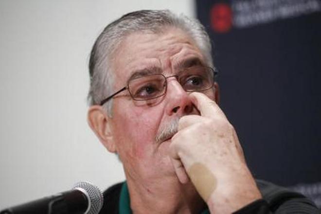 Ohio State University Professor William Clark wipes a tear from his eye during a news conference, Tuesday, Nov. 29, 2016, as he speaks of the police officer Alan Horujko who intervened during an attack at on campus the previous day in Columbus, Ohio. Investigators are looking into whether a car-and-knife attack at Ohio State University that injured several people was an act of terror by a student who had once criticized the media for its portrayal of Muslims. (AP Photo/John Minchillo)