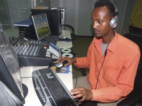 Hassan Yusuf monitors a computer in the control room during a live broadcast of the Somali government run radio Mogadishu, Monday, March 1, 2010. Al-Shabab, which controls most of southern Somalia and even most of the capital Mogadishu, is using the Internet and radio stations in an intensive campaign to discredit the embattled government, get its jihadist message out, attract more recruits at home and abroad and win over ordinary Somalis. For its part, the government has not wanted to be left behind in the propaganda war. In October it upgraded its Radio Mogadishu, changing antiquated equipment that had limited broadcast range. Hassan Yusuf monitors a computer in the control room during a live broadcast of the Somali government run radio Mogadishu, Monday, March 1, 2010. Al-Shabab, which controls most of southern Somalia and even most of the capital Mogadishu, is using the Internet and radio stations in an intensive campaign to discredit the embattled government, get its jihadist message out, attract more recruits at home and abroad and win over ordinary Somalis. For its part, the government has not wanted to be left behind in the propaganda war. In October it upgraded its Radio Mogadishu, changing antiquated equipment that had limited broadcast range.
