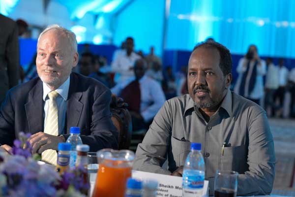 Somalia President Hassan Sheikh Mohamud (right) and the Special Representative of the UN Secretary-General (SRSG) for Somalia, Nicholas Kay (left), listen to speeches during the farewell party for Mr Kay held in Mogadishu, Somalia, on December 23, 2015. UN PHOTO | ILYAS AHMED