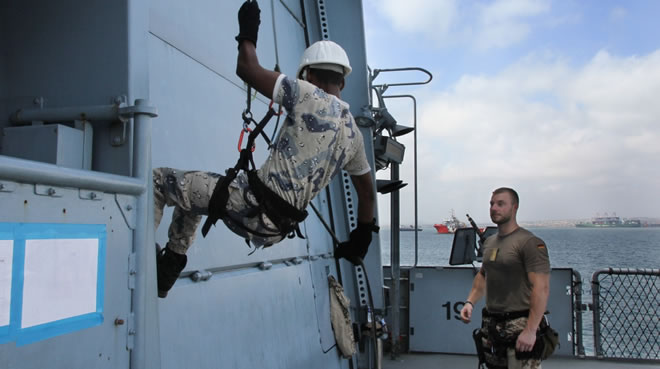 On board Op Atalanta Flagship, FGS Bayern - teaching Djibouti Coastguard how to abseil.