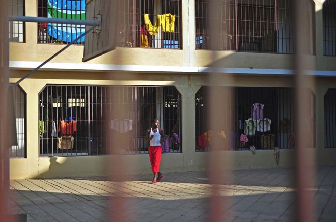 A prisoner walks at a prison in Garowe, Puntland state, in northeastern Somalia, on December 14, 2016. The prison facilitates the rehabilitation of convicted Somali pirates and suspected Al-Shabaab jihadists. / (MOHAMED ABDIWAHAB/AFP/Getty Images)