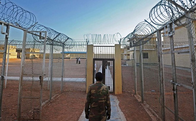 A prison warden stands at a prison in Garowe, Puntland state, in northeastern Somalia. The prison facilitates the rehabilitation of convicted Somali pirates and suspected Al-Shabaab jihadists. (MOHAMED ABDIWAHAB/AFP/Getty Images)