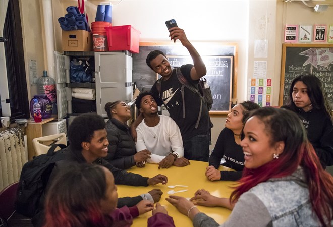 Mohamed Hassan took a selfie with friends at an after school hang-out at Roosevelt High School in Minneapolis, Minn., on December 2, 2016. Renee Jones Schneider