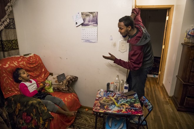 Mohamed Hassan had a conversation with his little sister Nhimo Guled while getting ready at home to go to a school fundraiser on February 24, 2017 in Columbia Heights, Minn. Renee Jones Schneider