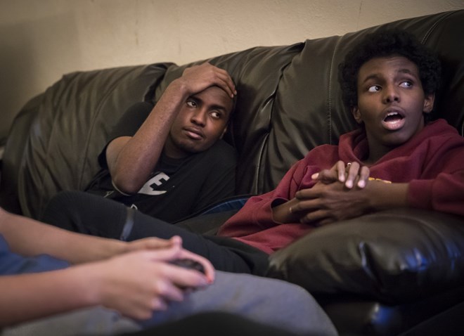 Mohamed Hassan hung out with his brother Ali Hassan watching friends play video games at an after school game tournament at Roosevelt High School on December 2, 2016. Renee Jones Schneider