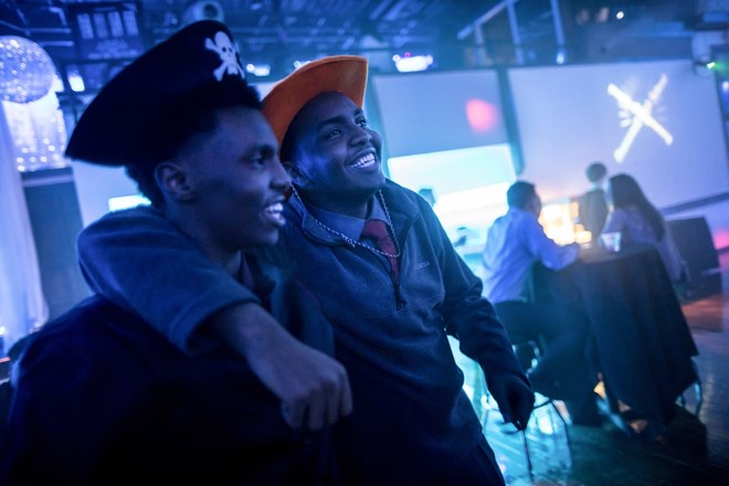 Mohamed Hassan wrapped his arm around he younger brother Ali Hassan as they hung out at a Roosevelt High School school dance at the Profile Event Center in Minneapolis, Minn. on February 16, 2017. They had on props from a photo booth.Renee Jones Schneider